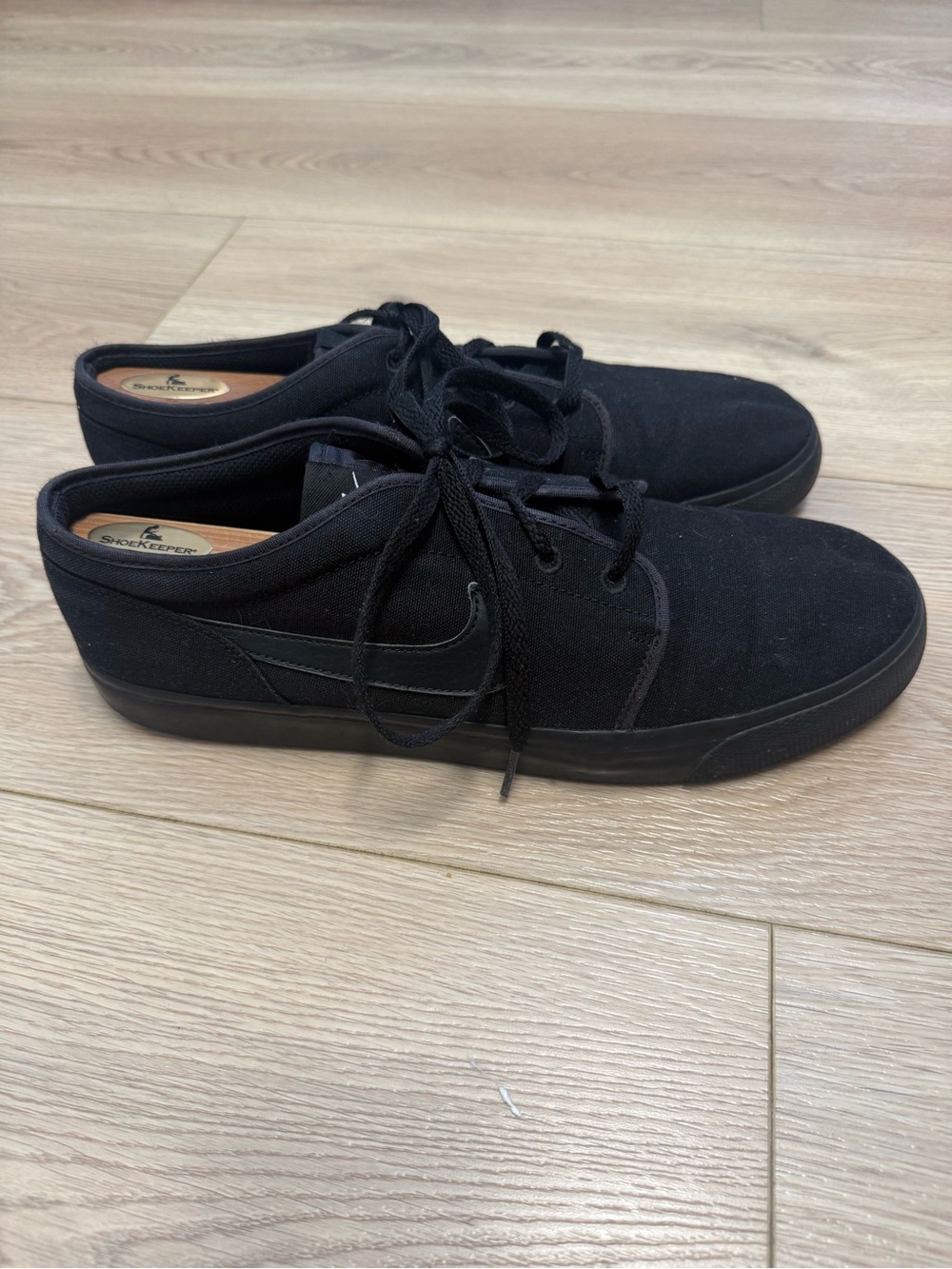 Nike Toki Low sneakers in a "Triple Black" Men’s Size 12
